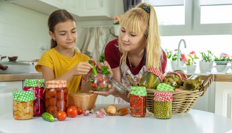 Woman,With,Jar,Preserved,Vegetables,For,Winter,Mother,And,Daughter.