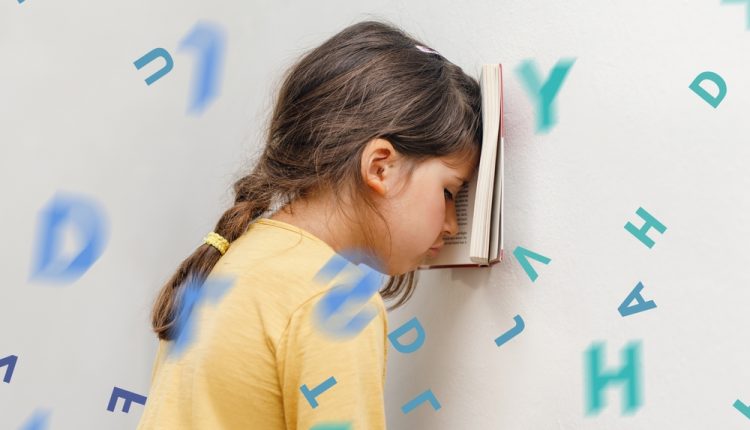 Sad,And,Tired,Caucasian,Girl,With,Dyslexia,Holds,A,Book