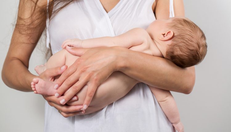 Young,Mother,Keep,Their,Newborn,Baby,On,Hands