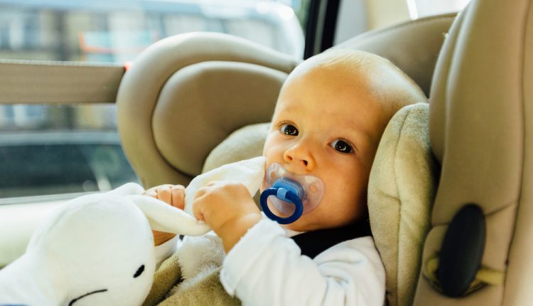 Baby,Playing,With,Toy,In,Car,Seat