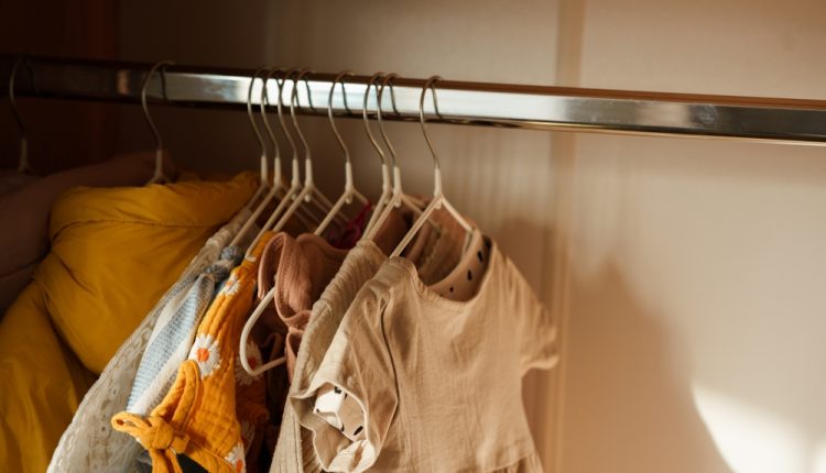 Children’s,Clothes,,Girls‘,Dresses,Hang,On,Hangers,In,An,Open