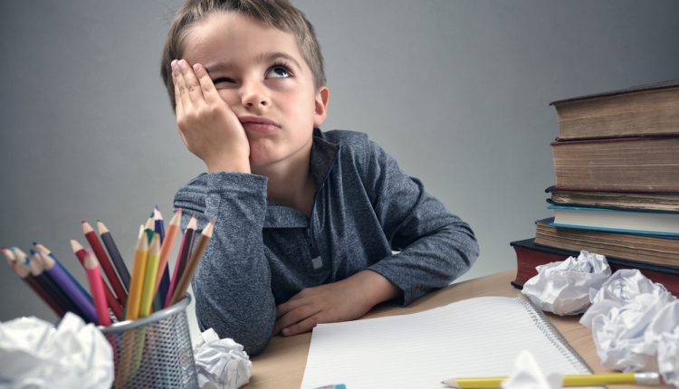 Thinking,Child,Bored,,Frustrated,And,Fed,Up,Doing,His,Homework