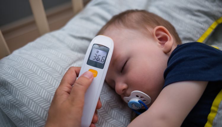 Sleeping,Baby,And,Body,Temperature,Measurement,With,A,Non-contact,Electronic