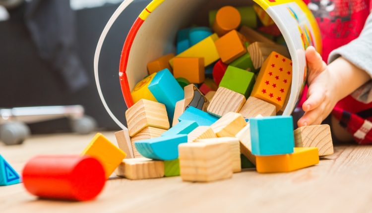 Small,Boy,Playing,With,Wooden,Blocks,On,Floor.,Baby,Toy